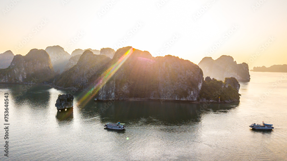 Aerial view floating fishing village and rock island, Halong Bay, Vietnam, Southeast Asia. UNESCO World Heritage Site. Junk boat cruise to Ha Long Bay. Popular landmark, famous destination of Vietnam - obrazy, fototapety, plakaty 