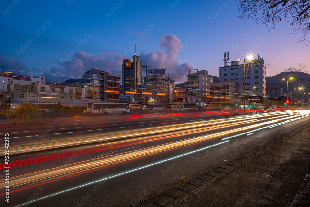 View of trail lights and city skyline in Port Louis at dusk, Port Louis, Mauritius View of trail lights and city skyline in Port Louis at dusk, Port Louis, Mauritius