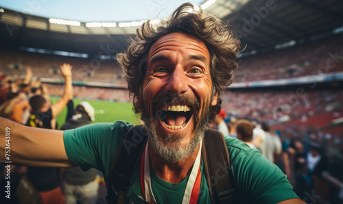 Euphoric Italian soccer fan celebrates with vibrant face paint, embracing team spirit and camaraderie at a lively stadium © Bartek