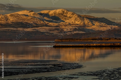 View across the Duddon Estuary towards the Coniston mountain range and the Lake District National Park, Furness Peninsula, Cumbria, England photo