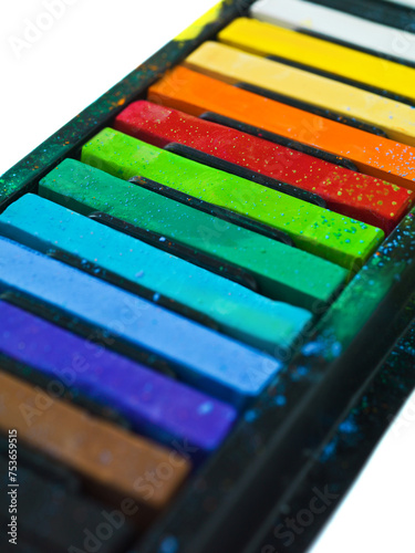 Paint, pastel and artist chalk in studio for rainbow or vibrant creativity, texture and pigments for fine or visual arts. Oil or watercolor sticks, color or palette to shade or blend with composition