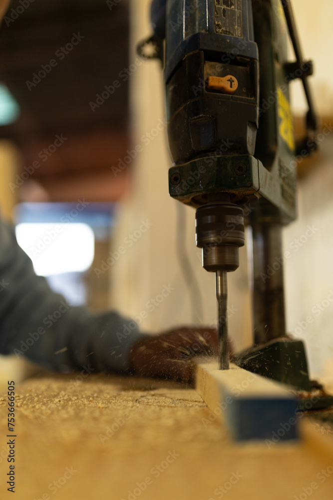 man working in a carpentry shop. Photographs of the work and backgrounds for publications with copy space.
