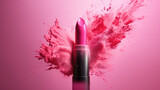 Bright lipstick with a splash of pink powder on the background.