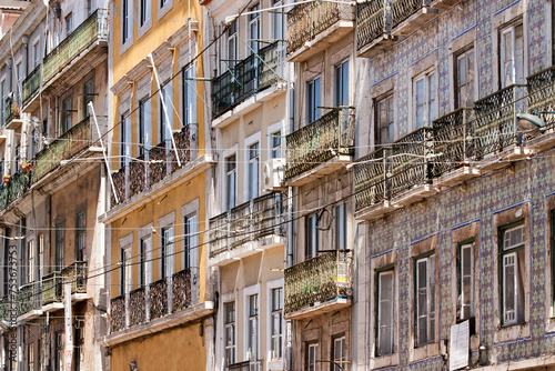 Cityscape of colorful traditional houses in Lisbon historic center, Portuguese balconies and construction, Portugal