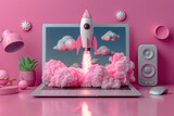 A pink laptop with a rocket on the screen