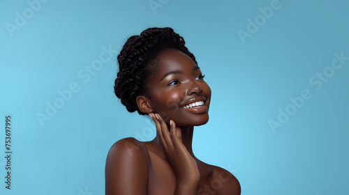 smiling beautiful black skin woman on blue background, skin beauty, skin care concept