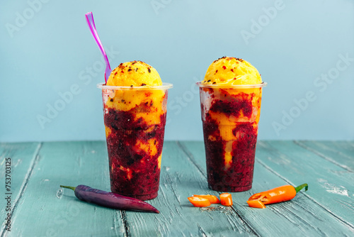Mexican spicy fruit ice cream against colorful background