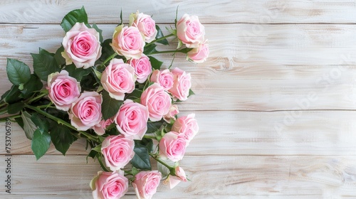 Bouquet of beautiful pink roses on white wooden background © Media Srock