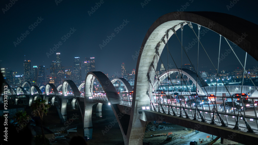 Fototapeta premium City skyline with traffic on a steel bridge