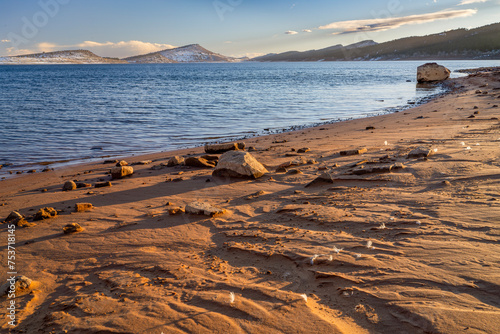 Slika na platnu Carter Lake in northern Colorado in winter scenery with a muddy shore