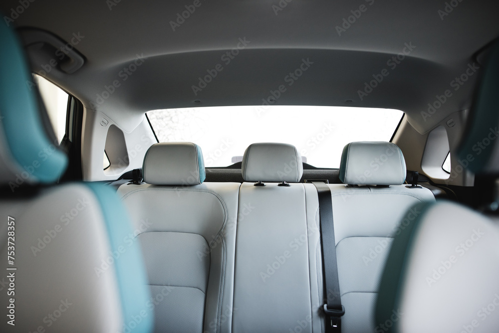 Back passenger seats in modern luxury car, frontal view
