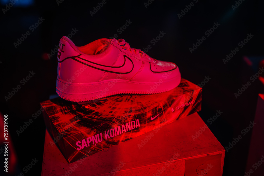 Riga, Latvia January 18, 2024 A neon pink sneaker is displayed on