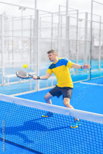 Open Tour template. Padel tennis player on the blue court background outdoors. Paddle tenis template for bookmaker design ads with copy space. Mockup for betting advertisement. Sports betting on tenis