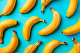 fruit pattern of fresh banana slices on green background. Top view