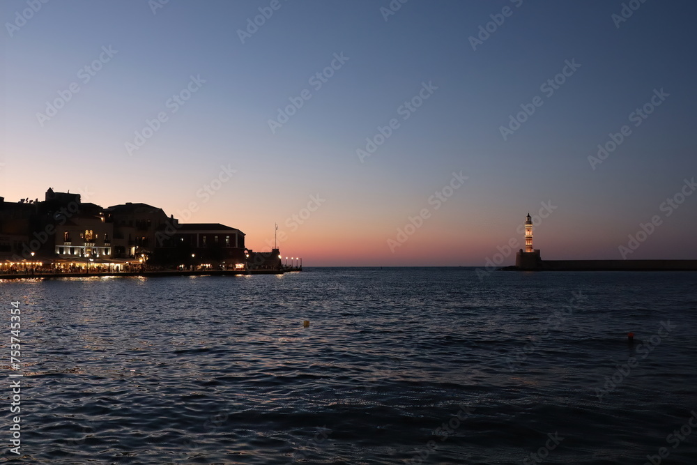 Lighthouse in Venetian Harbour, Chania, Crete, Greece at sunset