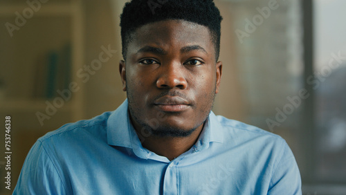 Headshot serious face leader in office studio male ethnic African American man looking to camera confident millennial guy businessman close-up business portrait of professional manager entrepreneur