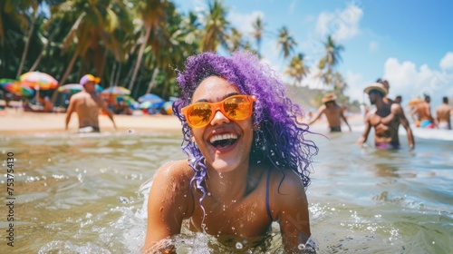Joyful Woman with Purple Hair Enjoying Sea Waves at a Tropical Beach
