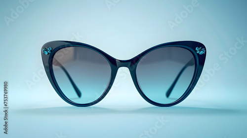 Cat eye glasses on blue surface, eye glass accessory in azure