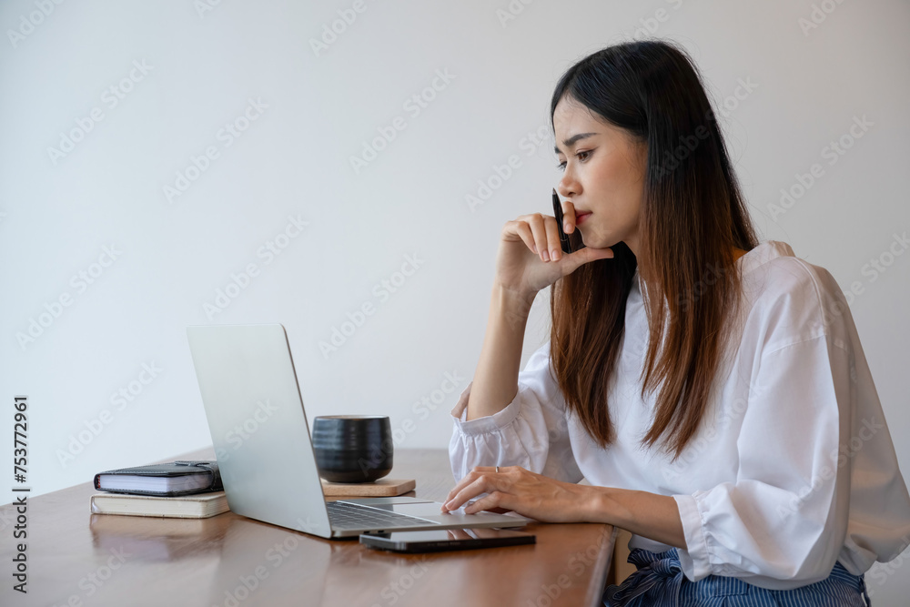 Young woman engages in online study or work at cafe. Young woman engages in online study or work at cafe.