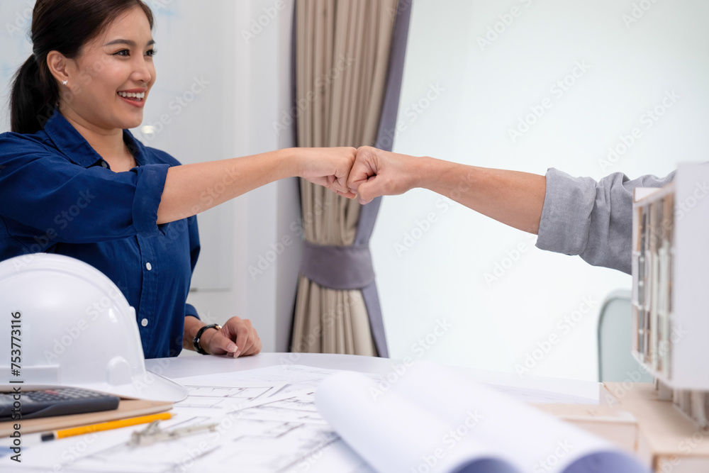Obraz premium Engineers, architects having a fistbump
