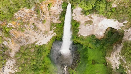 Aerial drone of Sipiso Piso waterfall in slow motion in the tropical jungle. Falls in the tropical forest. Sumatra, Indonesia. photo