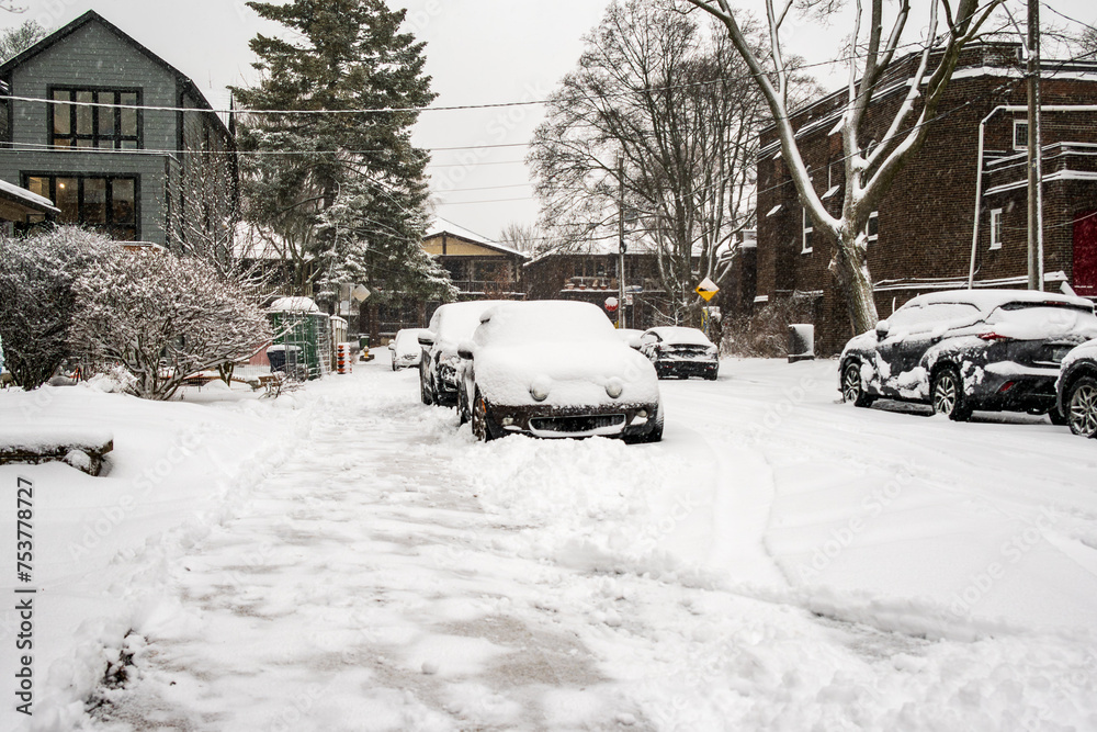 Snow on a recently cleared sidewalk on an older residential street shot in beaches neighbourhood toronto Snow on a recently cleared sidewalk on an older residential street shot in beaches neighbourhood toronto