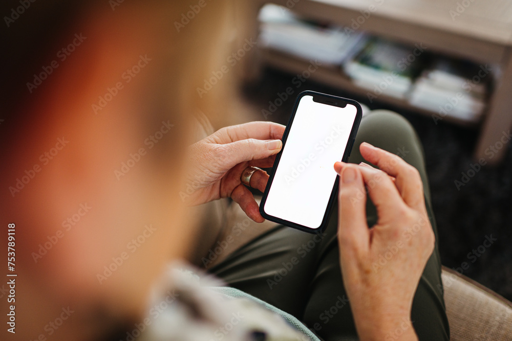© Melissa Milis Photography/Stocksy - Mobilphone mockup. Elder Woman's hands. © Melissa Milis Photography/Stocksy - Mobilphone mockup. Elder Woman's hands.