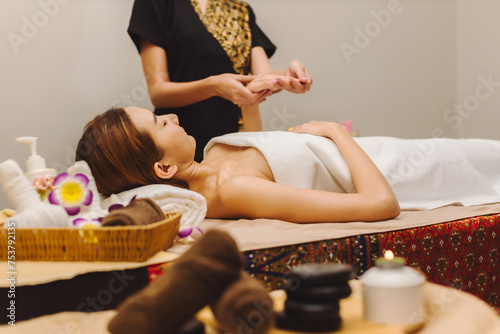 Relaxing with hand massage at beauty spa.