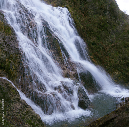 Waterfall in Pe  as de Aia. The waterfall of Aitzondo is located in the Natural Park of Pe  as de Aia or Aiako Harriak next to the city of Irun  Euskadi.