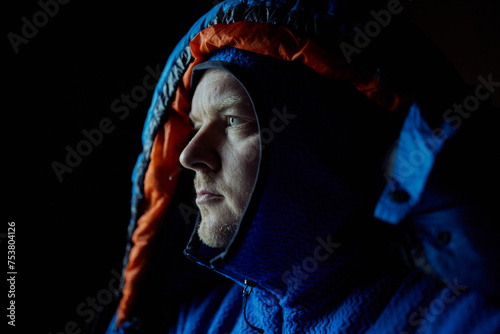 average mountain outdoor man in a dark cabin photo