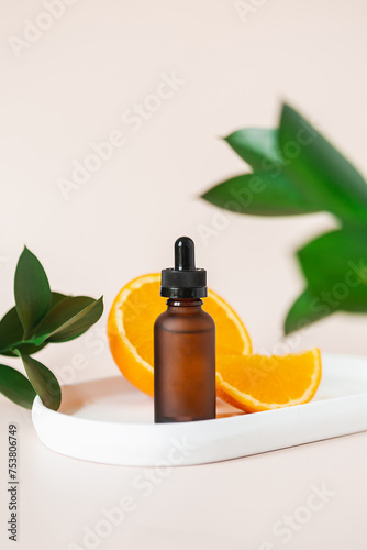 Vitamin C Serum in Matte Amber Bottle with Fresh Oranges