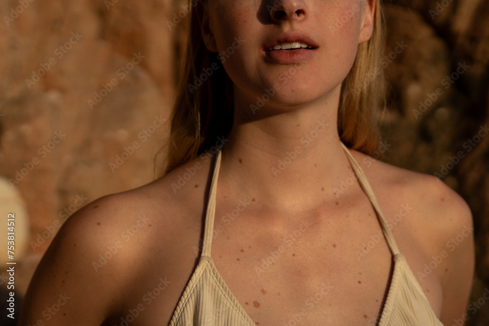 Blonde Woman In White Bikini During Golden Hour. Blonde Woman In White Bikini During Golden Hour.