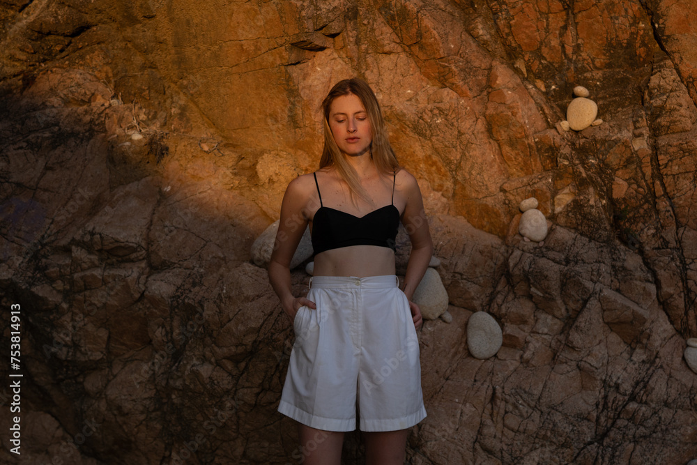 Blonde Woman In Summer Minimal Outfit Keeping Her Hands In Pockets Blonde Woman In Summer Minimal Outfit Keeping Her Hands In Pockets