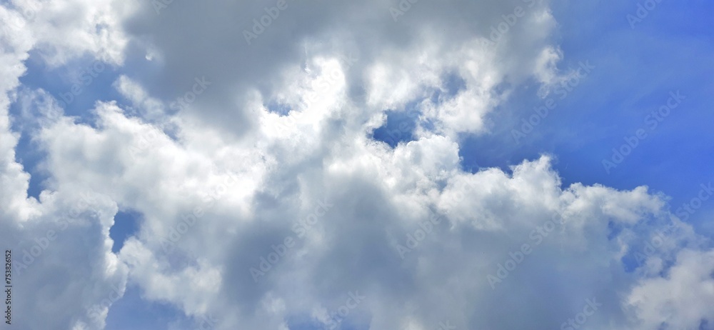Fototapeta premium Blue sky with white clouds background. Sky daylight natural view