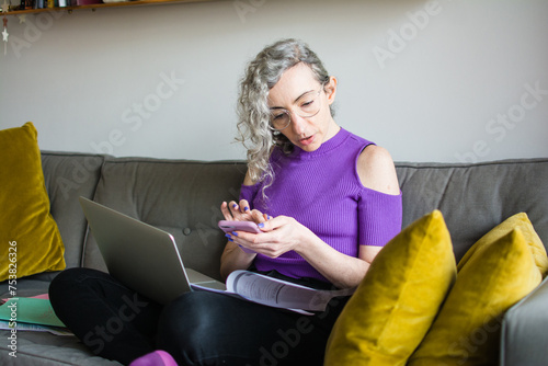 Woman checking credit card statements photo
