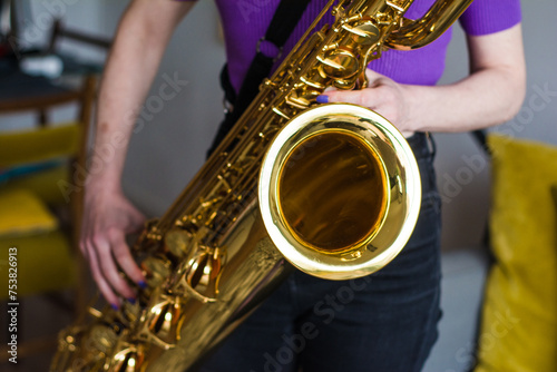 Anonymous woman playing the saxophone photo