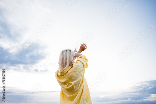 Rear view of a woman against the sky photo