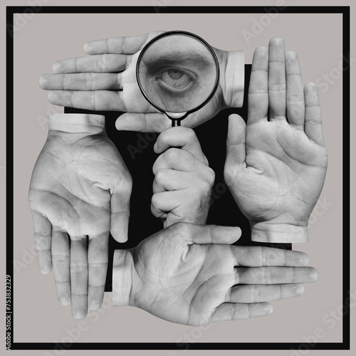 Hand holding magnifying glass with a eye inside and human palms photo