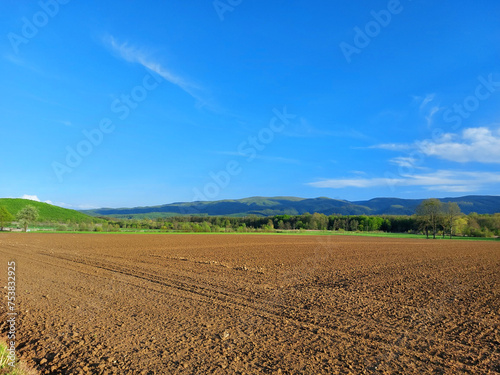brown field and view to Papuk hills in Slavonia - Croatia