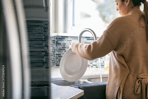 Kitchen: Woman Washing Dishes photo