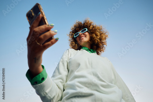 Stylish woman with a smartphone photo