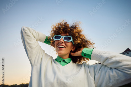 Excited woman with sunglasses photo