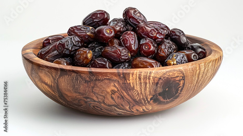 a bowl of dates or Tamar close-up shot isolated on white backrgound photo