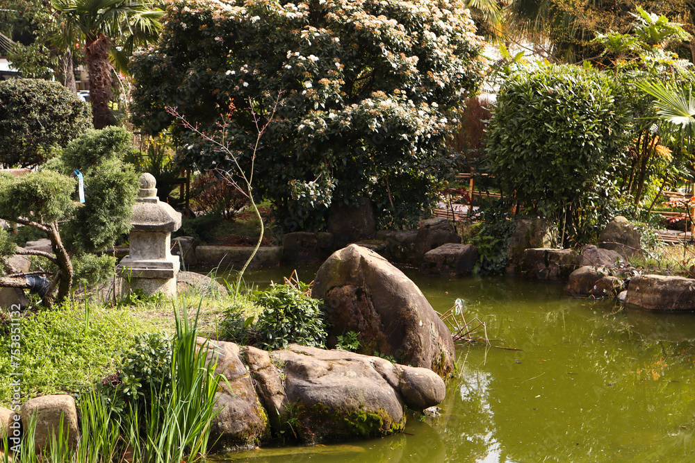 Asian-style park with a pagoda and lake. House of spirits. Park for relaxation and meditation. Asian-style park with a pagoda and lake. House of spirits. Park for relaxation and meditation.
