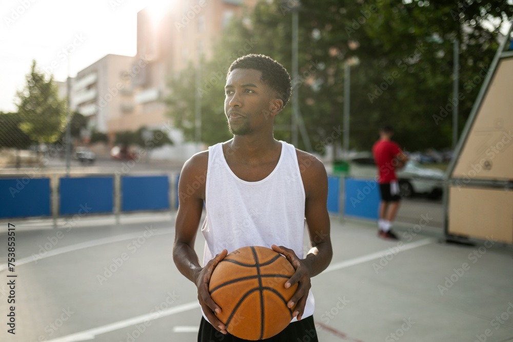 portrait of black teenager boy playing basketball portrait of black teenager boy playing basketball