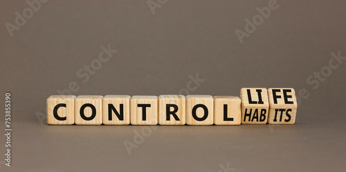 Control habits and life symbol. Concept words Control habits to Control life on beautiful wooden cubes. Beautiful grey table grey background, copy space. Business control habits and life concept.