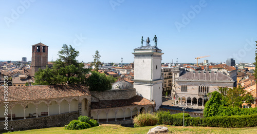 Panoramic iew of the tower of the cathedral and roofs of the city from the top of the garden of the castle of Udine, Italy. photo