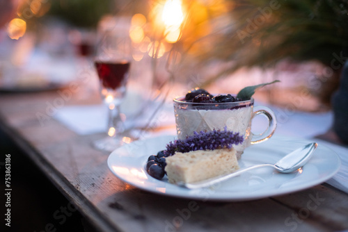 panna cotta dessert with berry compot and shortbread at party photo