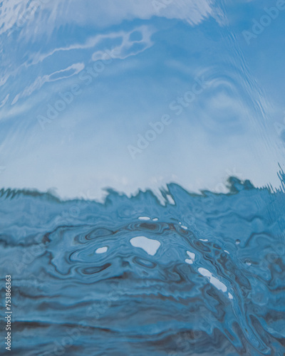 a scenery shot through a glassy impact of water