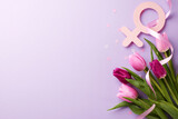 Honoring women's history month. Top view shot of pink and purple tulips, female gender symbol, decorative confetti on a lavender background with space for dedications or messages of appreciation